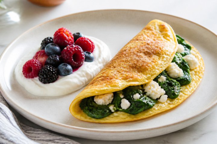 Mediterranean Spinach & Feta Omelette with Greek Yogurt & Berries