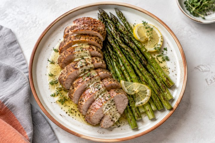 Pan-Seared Pork Tenderloin with Roasted Asparagus and Lemon-Herb Butter